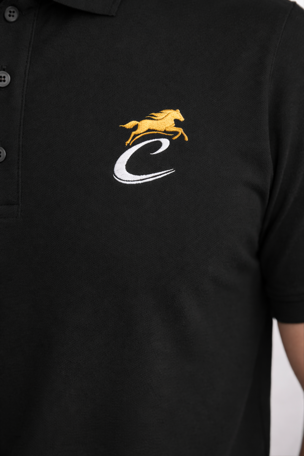 Black polo shirt with a logo featuring a horse and letter 'C' on a plain background