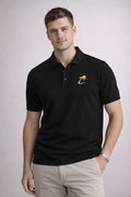 Man wearing a black polo shirt with a logo on a light gray background